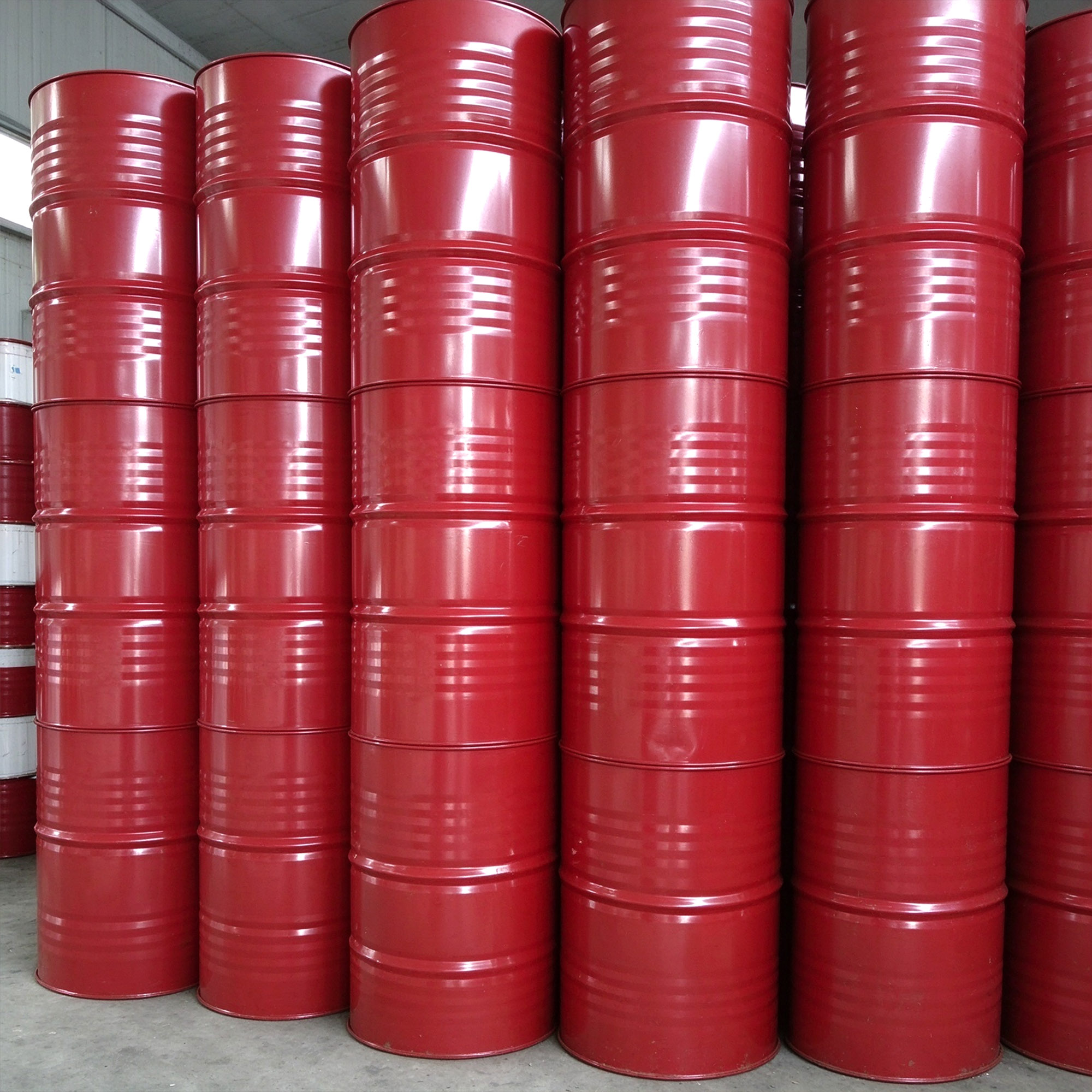 Rows of red steel drums from the supplied packaging photographs